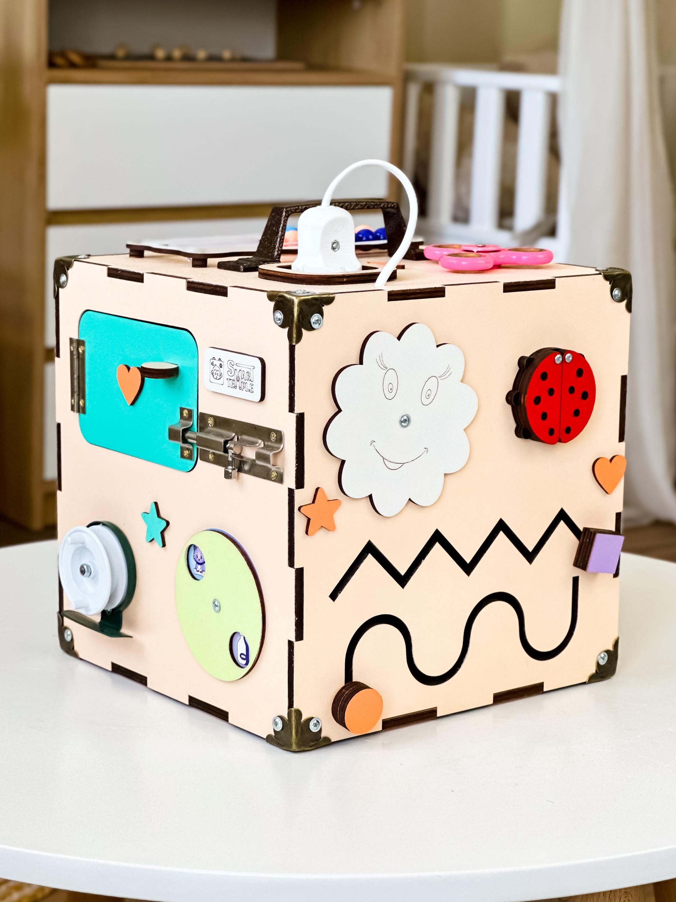 toddler wooden cube,
montessori busyboard,
baby activity cube,
busy board toddler,
wooden baby toys,
toddler smart toys,
toy for toddlers,
montessori toy,
educational toys,
busy cube montessori,
montessori cube,
sensory toys,
activity cube,