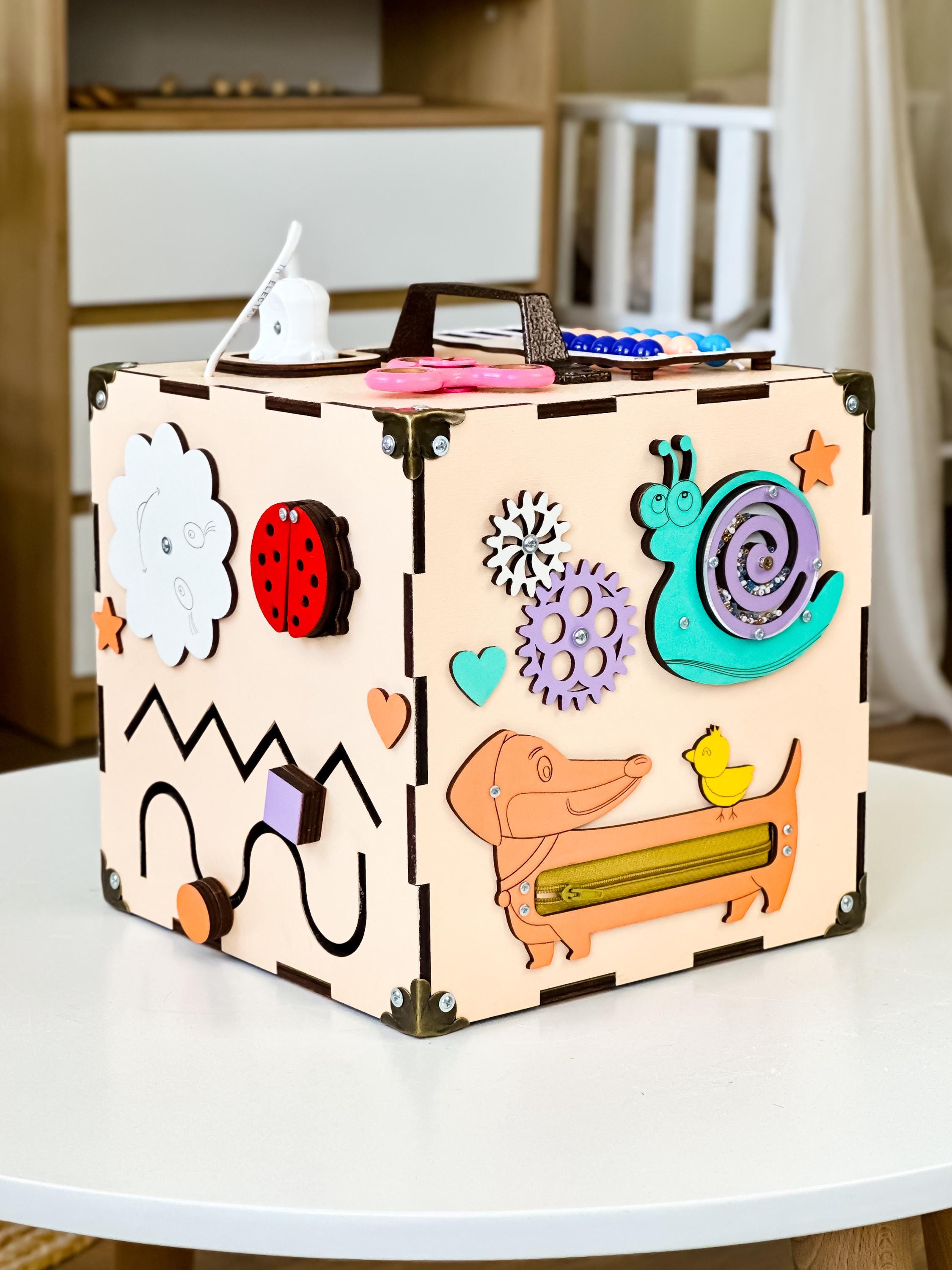 toddler wooden cube,
montessori busyboard,
baby activity cube,
busy board toddler,
wooden baby toys,
toddler smart toys,
toy for toddlers,
montessori toy,
educational toys,
busy cube montessori,
montessori cube,
sensory toys,
activity cube,